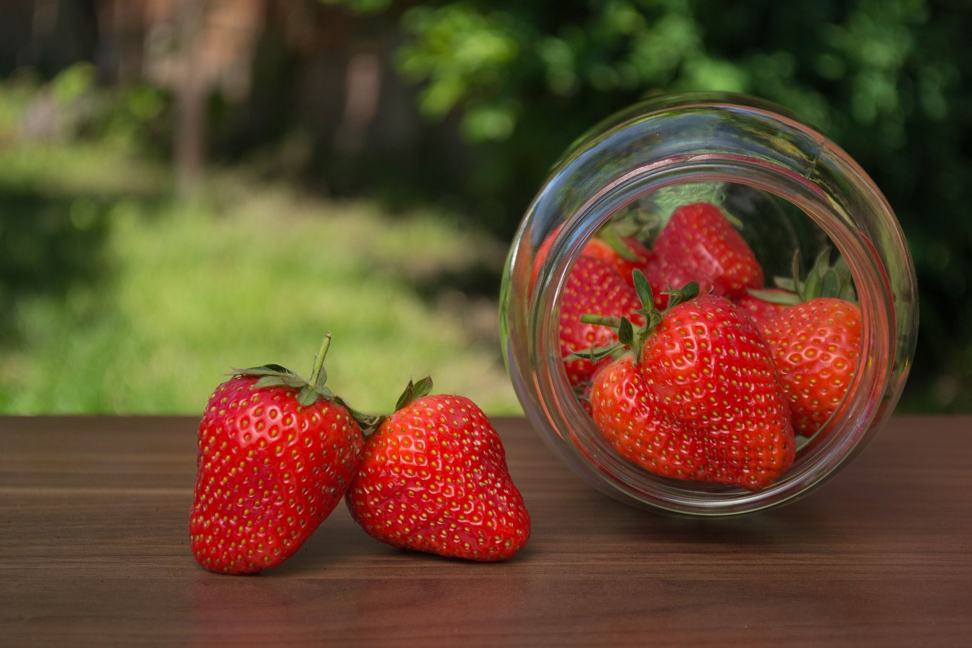 strawberries in jar on side